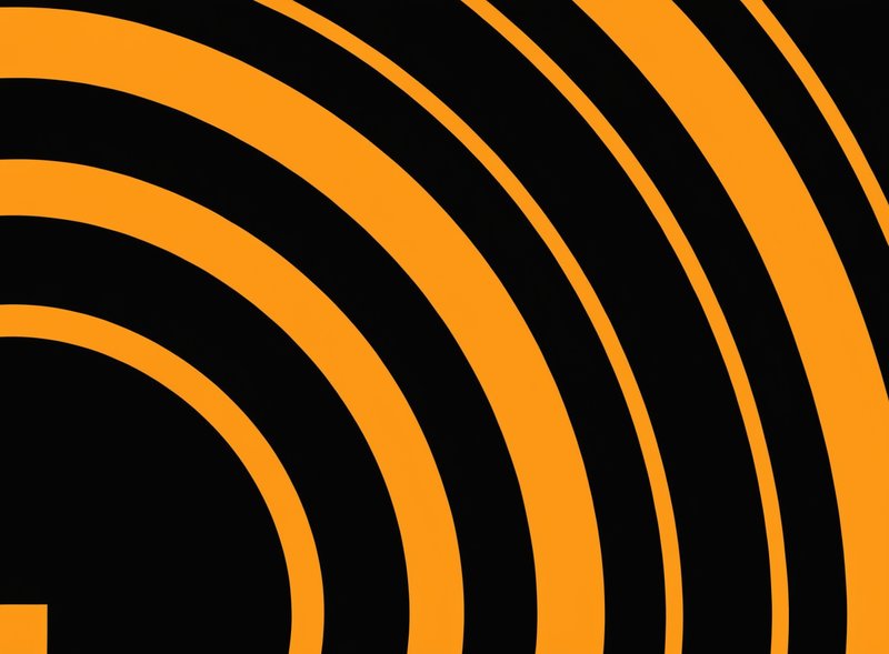 An abstract graphic with orange arcs and lines against a black background.